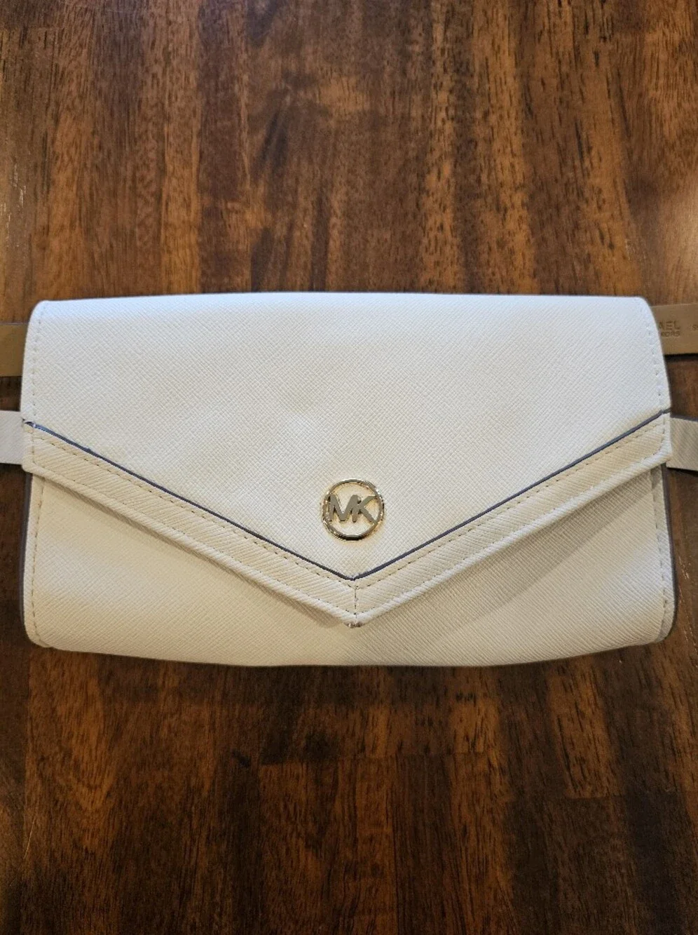 Michael Kors white envelope belt bag features gold-tone hardware